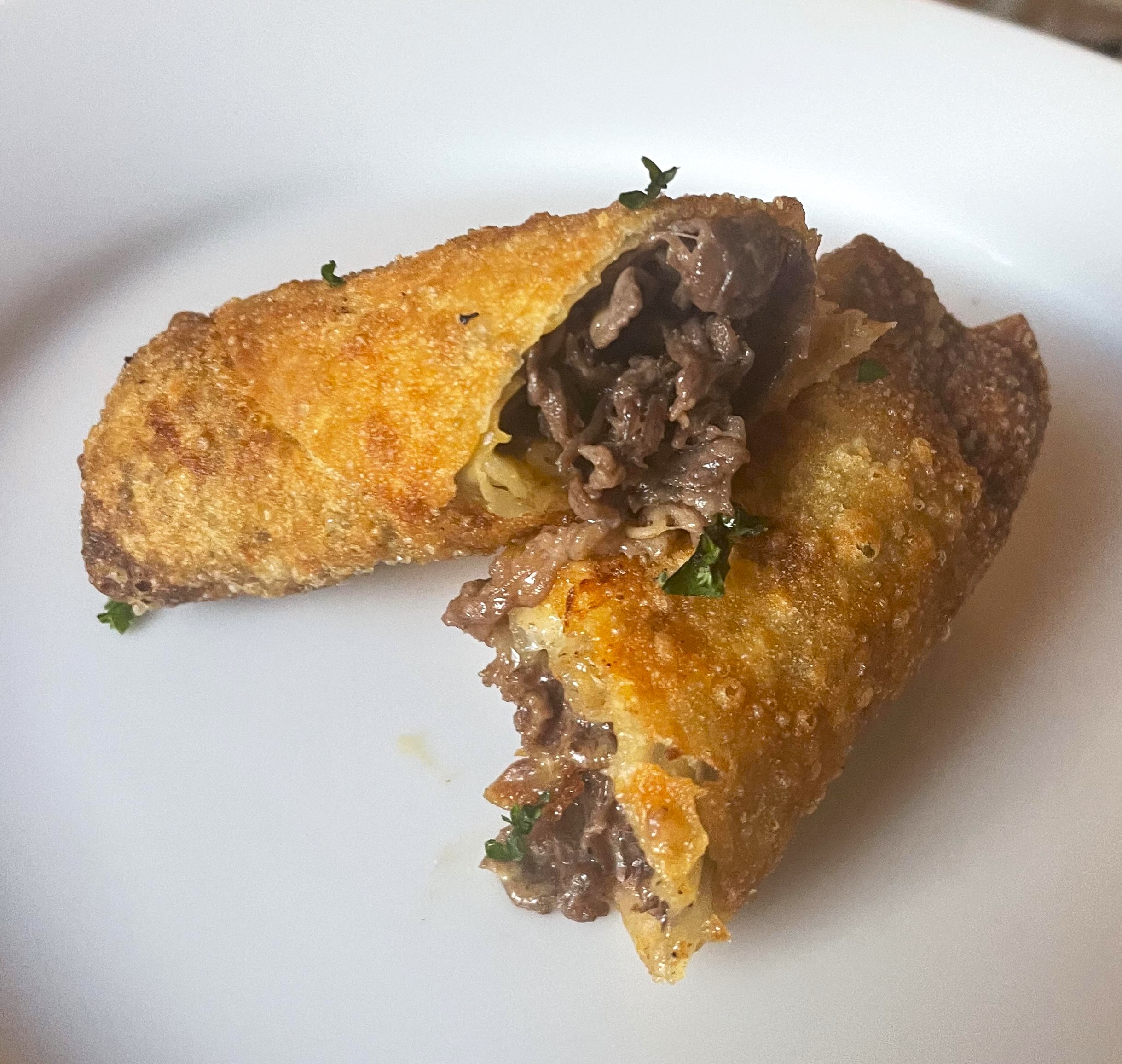 Steak and cheese egg rolls