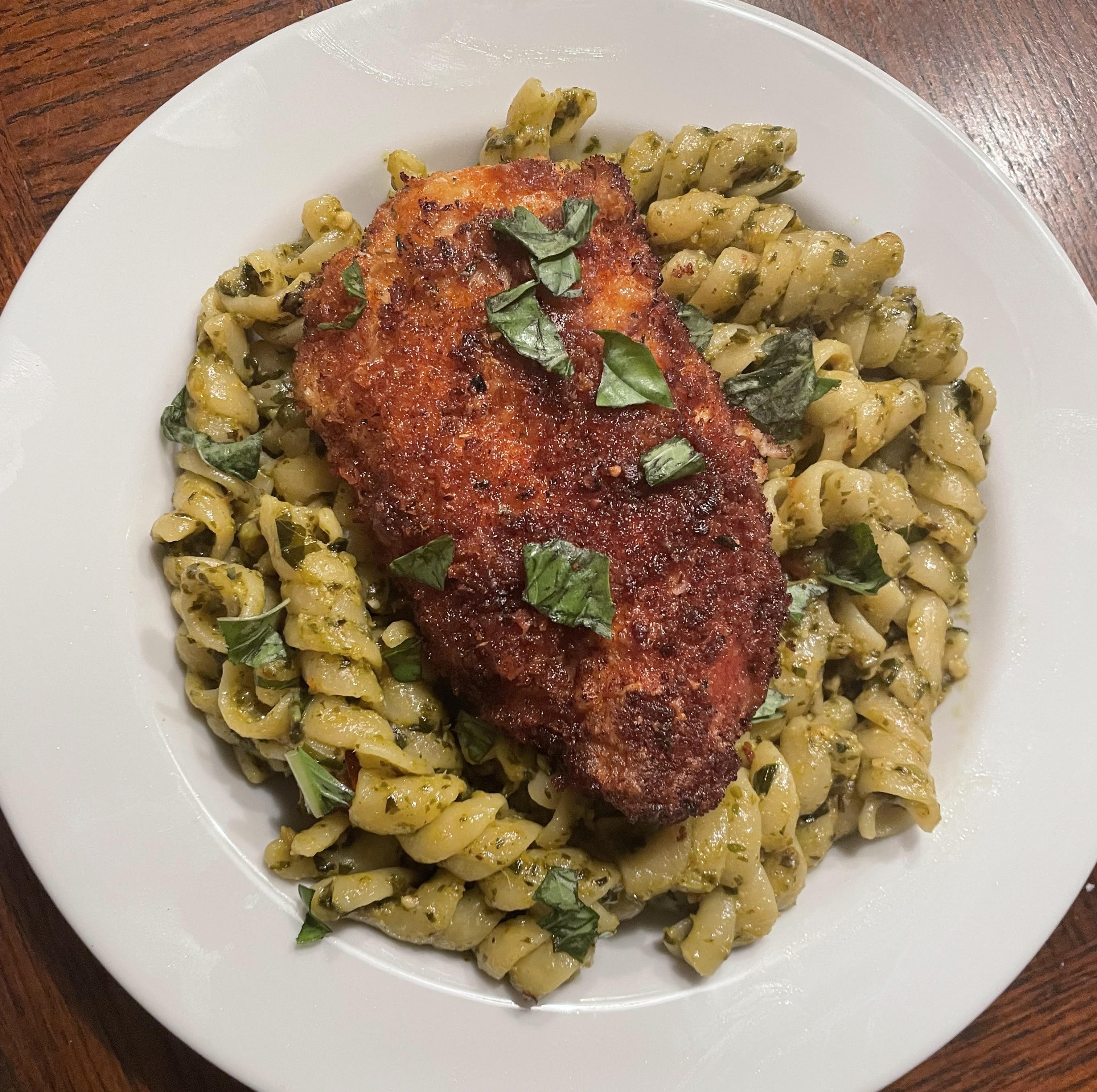 Chicken cutlet over pesto sauce